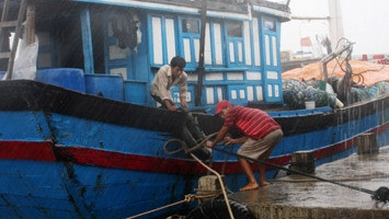 Local fishermen prepare for the arrival of typhoon Krosa.