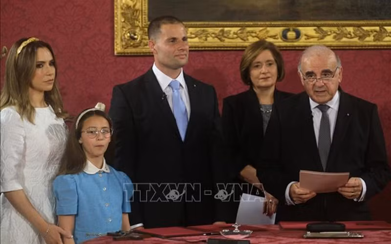 Robert Abela (middle) is sworn in as the new Prime Minister before President George Vella (right) following his victory in legislative elections.