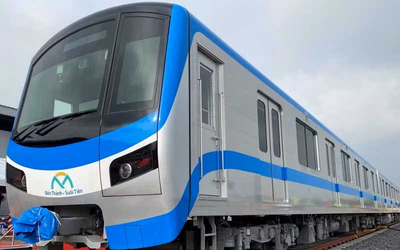 The blue and white three-car train is designed to assist people with disabilities. 