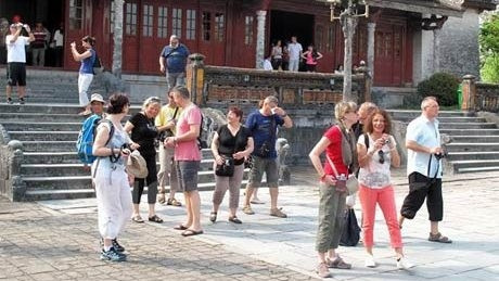  Foreign tourists visit a relic at the Hue Citadel. (Credit: Vietnam+)