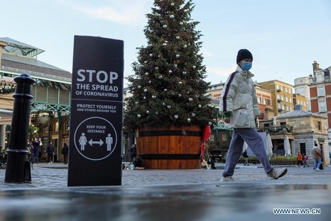 A person walks through Covent Garden, in London, Britain, on Nov. 23, 2020. British Prime Minister Boris Johnson announced Monday a "tougher" tiered system of coronavirus restrictions to replace England's current lockdown when it ends on Dec. 2. (Photo: Xinhua)