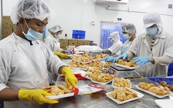 At the poultry processing factory of Koyu & Unitek Co., Ltd. (Photo: THUY HAI)