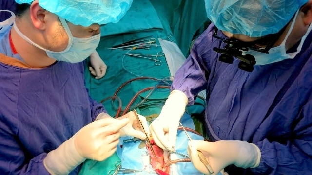 Doctors at the Hanoi-based Vietnam-Germany Friendship Hospital carry out a heart transplant on a young patient.