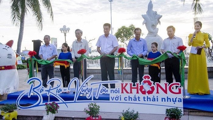 Delegates cut the ribbon to launch the exhibition.