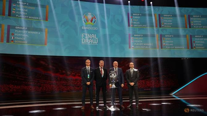 Soccer Football - Euro 2020 Finals Draw - Romexpo, Bucharest, Romania - November 30, 2019 (L - R) Finland coach Markku Kanerva, Denmark coach Age Hareide, Russia coach Stanislav Cherchesov and Belgium coach Roberto Martinez pose after being drawn in Group B. (Reuters)