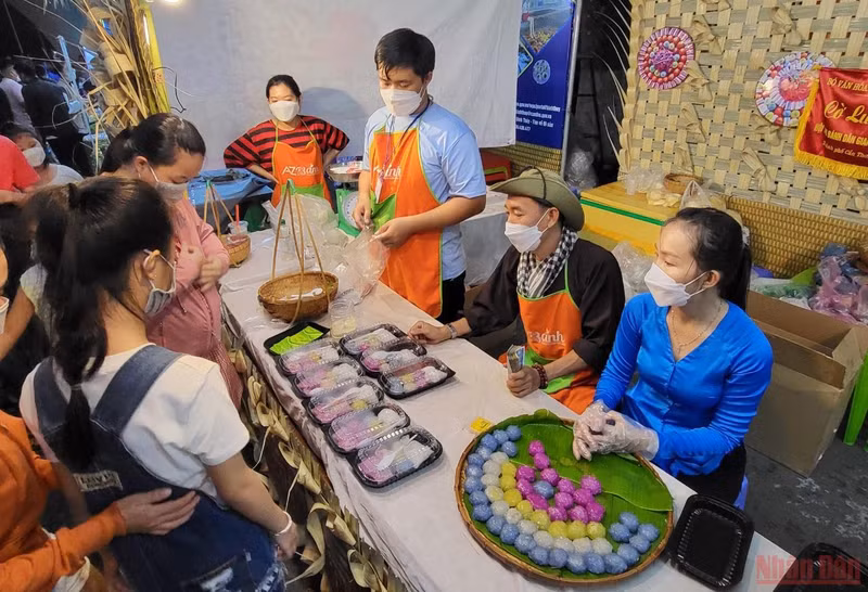 Visitors enjoy traditional cakes at the festival.