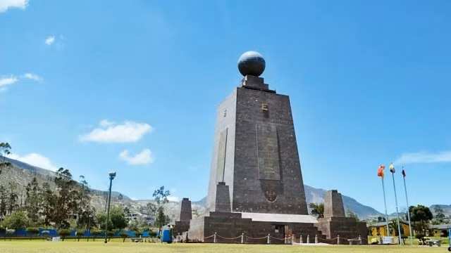Monument to the Equator at Mitad del Mundo complex which marks the passage of the equator through Ecuador.