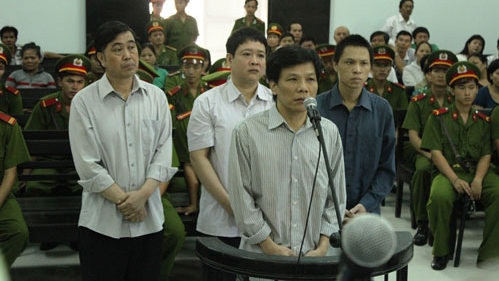 The defendants stand trial on charges of embezzlement.