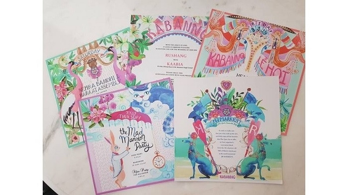 The youthful wedding cards of the billionaire couple.
