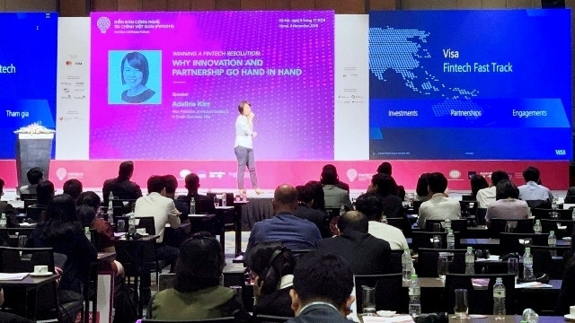 Experts discuss fintech ecosystem development in Vietnam at the forum. (Photo: NDO/Hong Anh)