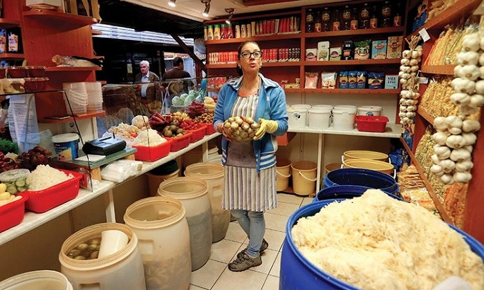 A vendor at a food market in Budapest, Hungary. (Photo: Reuters)