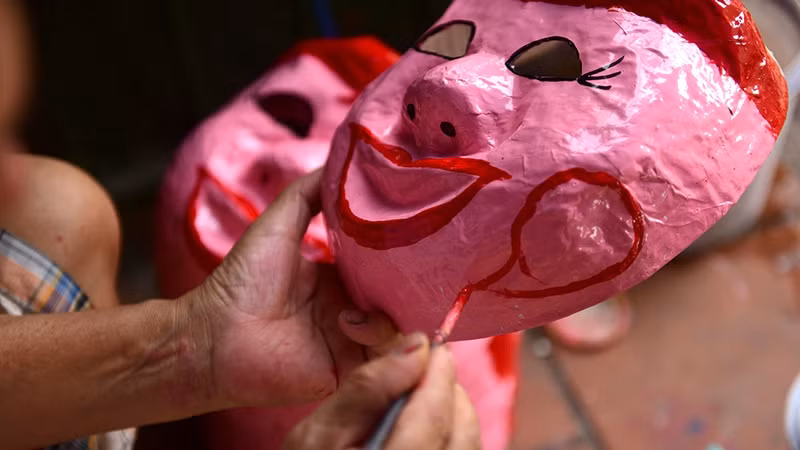 In a small house on Hang Than Street, Hanoi, paper masks are produced under the skilful hands of an old couple on every Mid-Autumn Festival.