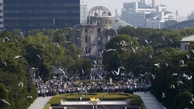 Doves fly over Peace Memorial Park with Atomic Bomb Dome in the background at a ceremony in Hiroshima on the 70th anniversary of the atomic bombing of the city. (Reuters)