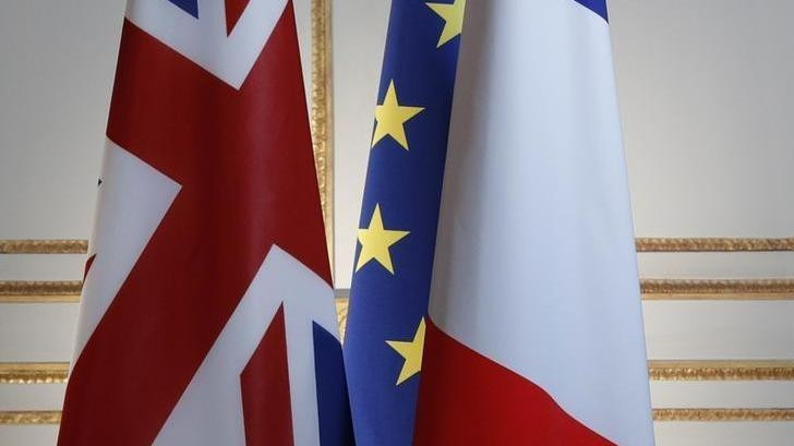 Britain, European and French flags are seen before a news conference at the Elysee Palace in Paris, France. (Credit: Reuters)