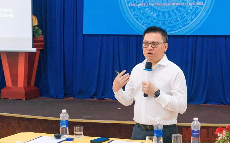 Editor-in-Chief of Nhan Dan Newspaper Le Quoc Minh speaking at the conference.