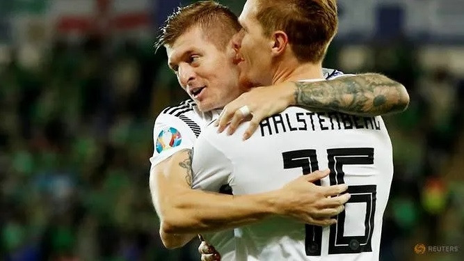 Soccer Football - Euro 2020 Qualifier - Group C - Northern Ireland v Germany - Windsor Park, Belfast, UK - September 9, 2019 Germany's Marcel Halstenberg celebrates scoring their first goal with Toni Kroos. (Reuters)