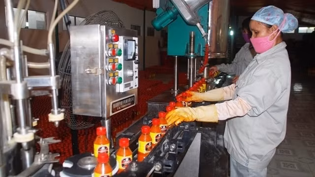 A Muong Khuong chili sauce production line