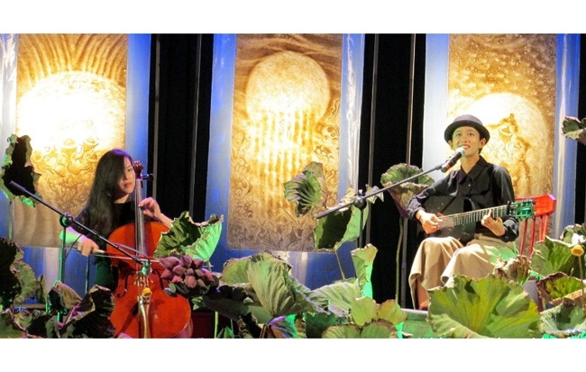 An art performance in a space filled with Truc chi works