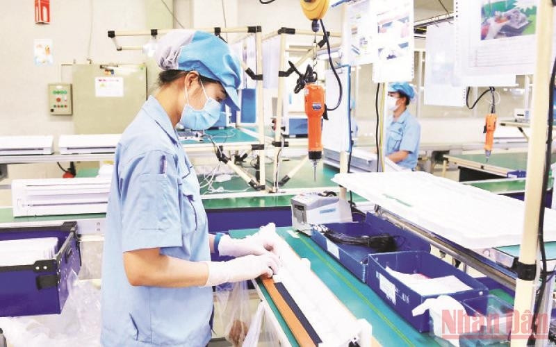 Manufacturing electronic components at Rhythm Precision Vietnam Co., Ltd. in Noi Bai Industrial Park, Hanoi.