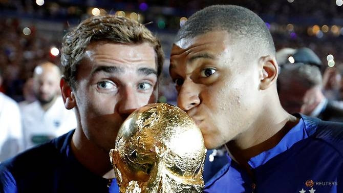 France's Kylian Mbappe and Antoine Griezmann celebrate with the World Cup trophy at Stade de France, Saint-Denis, France - September 9, 2018. (Reuters) 