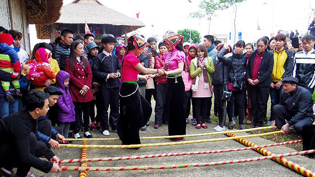 Having fun at a bamboo pole dance 