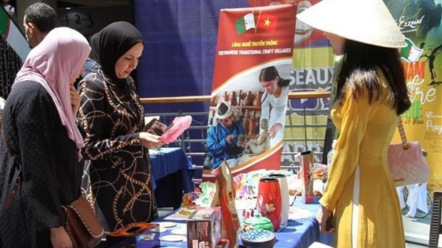 Visitors at Vietnam's exhibition area (Photo: VNA)