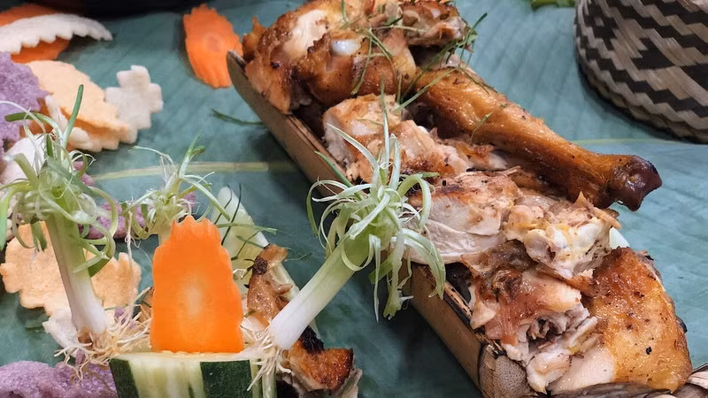 Grilled chicken in bamboo tube
