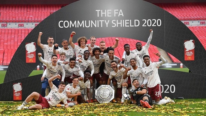 FA Community Shield - Arsenal v Liverpool - Wembley Stadium, London, Britain - August 29, 2020 Arsenal players celebrate with the trophy after winning the FA Community Shield, as play resumes behind closed doors following the outbreak of the coronavirus disease. (Photo: Pool via Reuters)