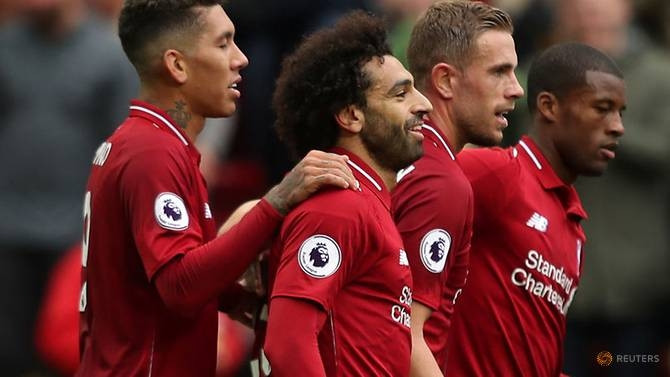 Liverpool's Mohamed Salah celebrates scoring their third goal with teammates. (Reuters)