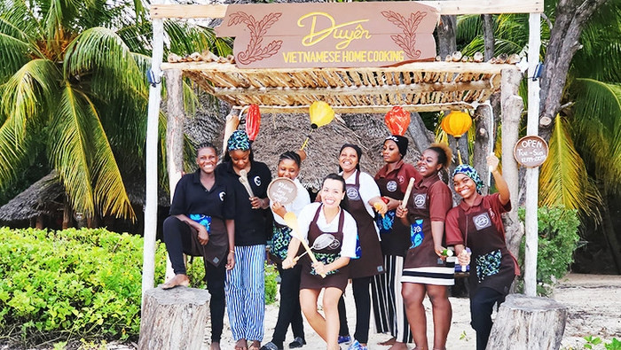Kim Anh and local staff in front of the restaurant 
