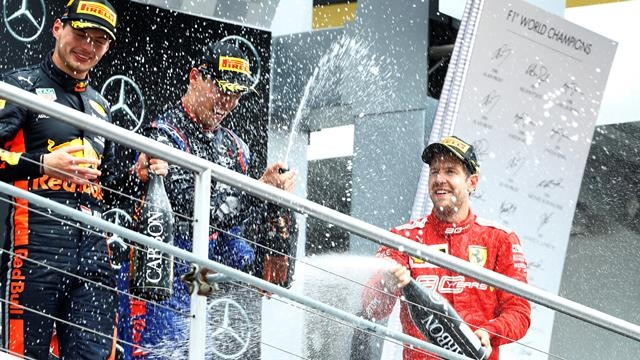 Formula One F1 - German Grand Prix - Hockenheimring, Hockenheim, Germany - July 28, 2019 Race winner Max Verstappen of Red Bull, third placed Daniil Kvyat of Toro Rosso and second placed Sebastian Vettel of Ferrari spray champagne on the podium after the race. (Photo: Reuters)