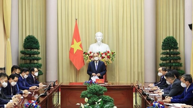 President Nguyen Xuan Phuc meets Yoon Sang Ho, Chairman of the Korean Association in Vietnam and representatives of a number of large ROK corporations on July 15. (Photo: VNA)