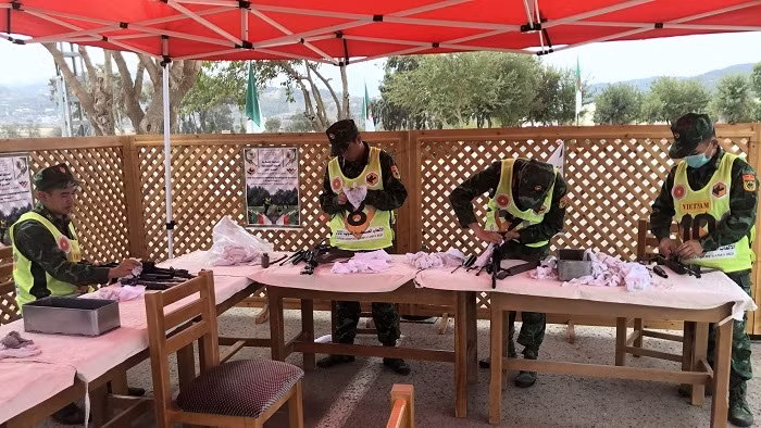 Members of the Vietnamese team prepare for the AK rifle team shooting event. (Photo: VNA)