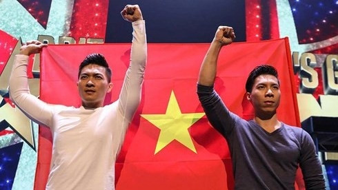 The Giang Brothers hold their national flag aloft at Britain’s Got Talent 2018