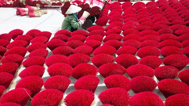 Bunches of incense sticks are left to dry outdoor