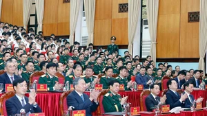 Party General Secretary To Lam (front, second, left) attends a meeting with the Military Technical Academy on March 17. (Photo: VNA)