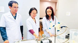 Professor, Dr Tran Thi Viet Nga (centre), Director of the Viet Nam–Japan Institute of Advanced Technology and Senior Lecturer at the Faculty of Environmental Engineering, Ha Noi University of Civil Engineering, was honoured with the Kovalevskaia Award 2025. Photo: LE THUY