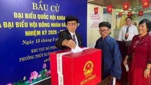 Elderly voters in Hue City cast their ballots on election day, March 15, 2026.