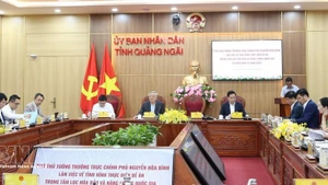 At the working session between Standing Deputy Prime Minister Nguyen Hoa Binh and authorities of central Quang Ngai province (Photo: VNA)