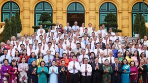 State President Luong Cuong and delegates (Photo: VNA)