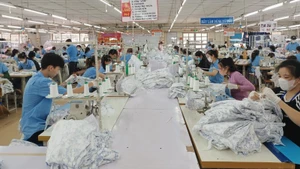 Textile and garment production at Hoa Tho Garment Factory (Quang Ngai). (Photo: nhandan.vn)