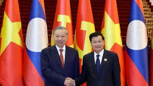 General Secretary of the Communist Party of Viet Nam Central Committee To Lam (left) and General Secretary of the Lao People's Revolutionary Party Central Committee and President of Laos Thongloun Sisoulith. (Photo: VNA)