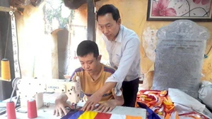 Ensuring employment for persons with disabilities is widely seen as one of the most effective ways to help them integrate into the community quickly and sustainably. (Photo: nhandan.vn)