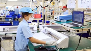 Production of electronic components at Rhythm Precision Viet Nam Co., Ltd. in Noi Bai Industrial Park, Ha Noi. (Photo: NGUYEN QUANG)