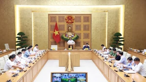 Prime Minister Pham Minh Chinh chairs a teleconference to review recovery efforts following the devastating impact of Typhoon Bualoi, and to prepare for the arrival of Typhoon Matmo. (Photo: VNA)
