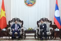 Vietnamese Deputy Prime Minister and Minister of National Defence Gen. Phan Van Giang and his Lao counterpart Gen. Khamlieng Outhakaysone at the meeting. (Photo: VNA)