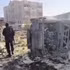 Armed men guard the scene after a car bomb attack in Aden, Yemen, on January 21, 2026. (Photo: Xinhua)