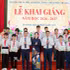 Representatives of the National Fund for Vietnamese Children and Vietcombank present scholarships to students facing difficult circumstances at the programme. (Photo: NFVC)