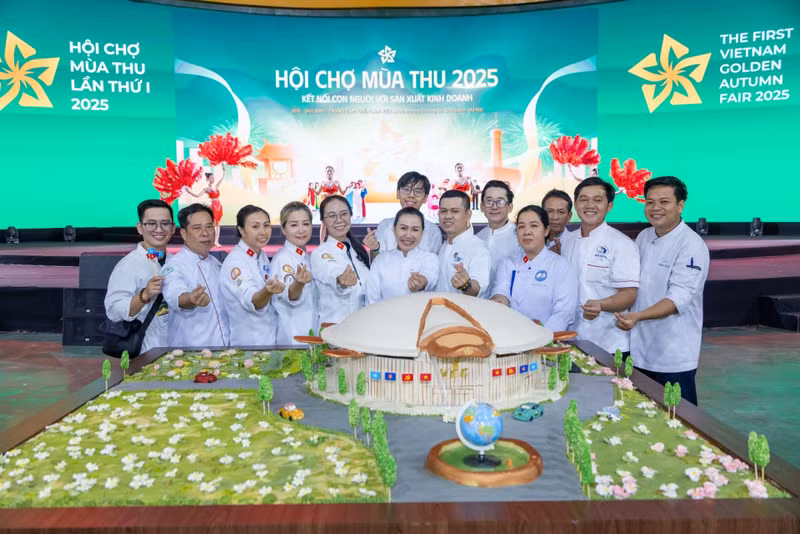 Artisans and the model of the National Exhibition and Convention Centre at the first Autumn Fair 2025.