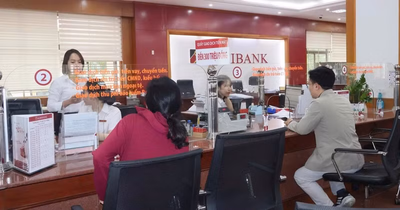Customers conduct transactions at an Agribank branch.
